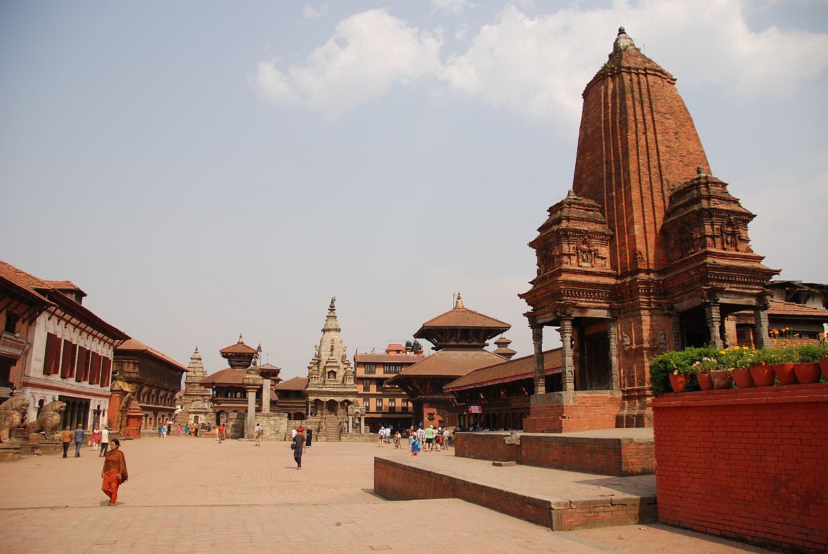 Kathmandu Bhaktapur 01 Bhaktapur Durbar Square From West With Shiva Kedarnath Temple Bhaktapur (1401m) is a traffic-free city 13 km east of Kathmandu, with cobblestone streets linking a string of temples, courtyards and squares. Bhaktapur Durbar Square is one of the world heritage sites in Nepal, reflecting the city's rich culture, art and architectural design. The 1934 earthquake destroyed many of Bhaktapur�s Durbar Square temples. Here is a view of Bhaktapur Durbar Square from the west, with the Golden Gate and Palace of 55 Windows on the left, the Vatsala Durga Temple in the centre, and Shiva Kedarnath Temple on the right.